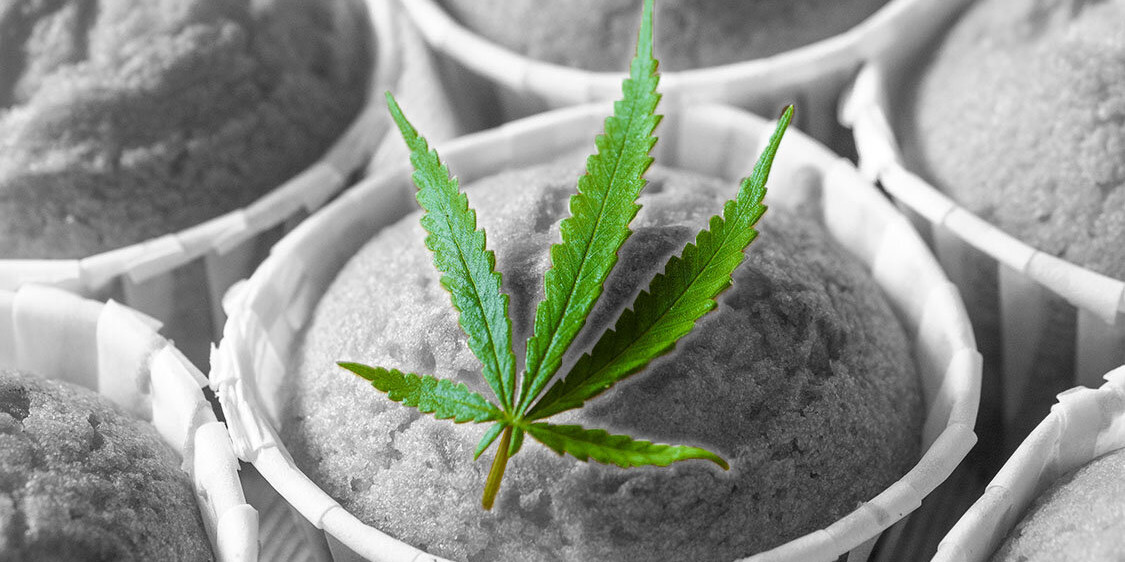 Green Marijuana Leaf on top of a black and white image of muffins
