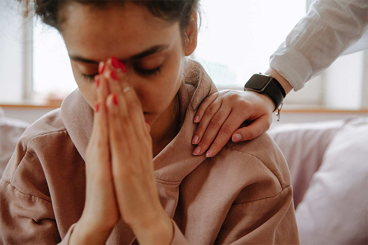 Person experiencing symptoms of consuming too much THC